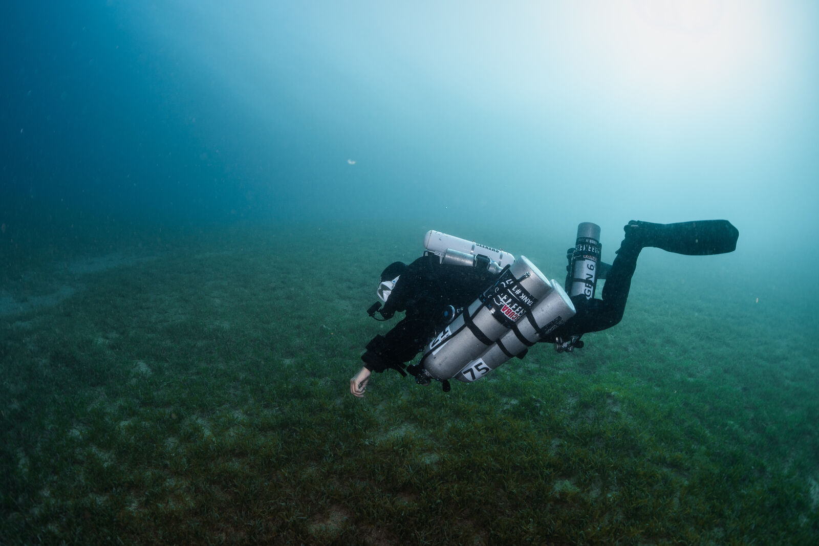 female CCR diver with stages in a drysuit